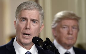 Supreme Court nominee Judge Neil M. Gorsuch speaks as President Donald Trump looks on in the East Room of the of White House in Washington, D.C., on T
