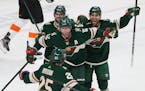 Minnesota Wild's Eric Staal looks to teammate Jonas Brodin in celebration after Staal scored a goal against the Philadelphia Flyers in the first perio