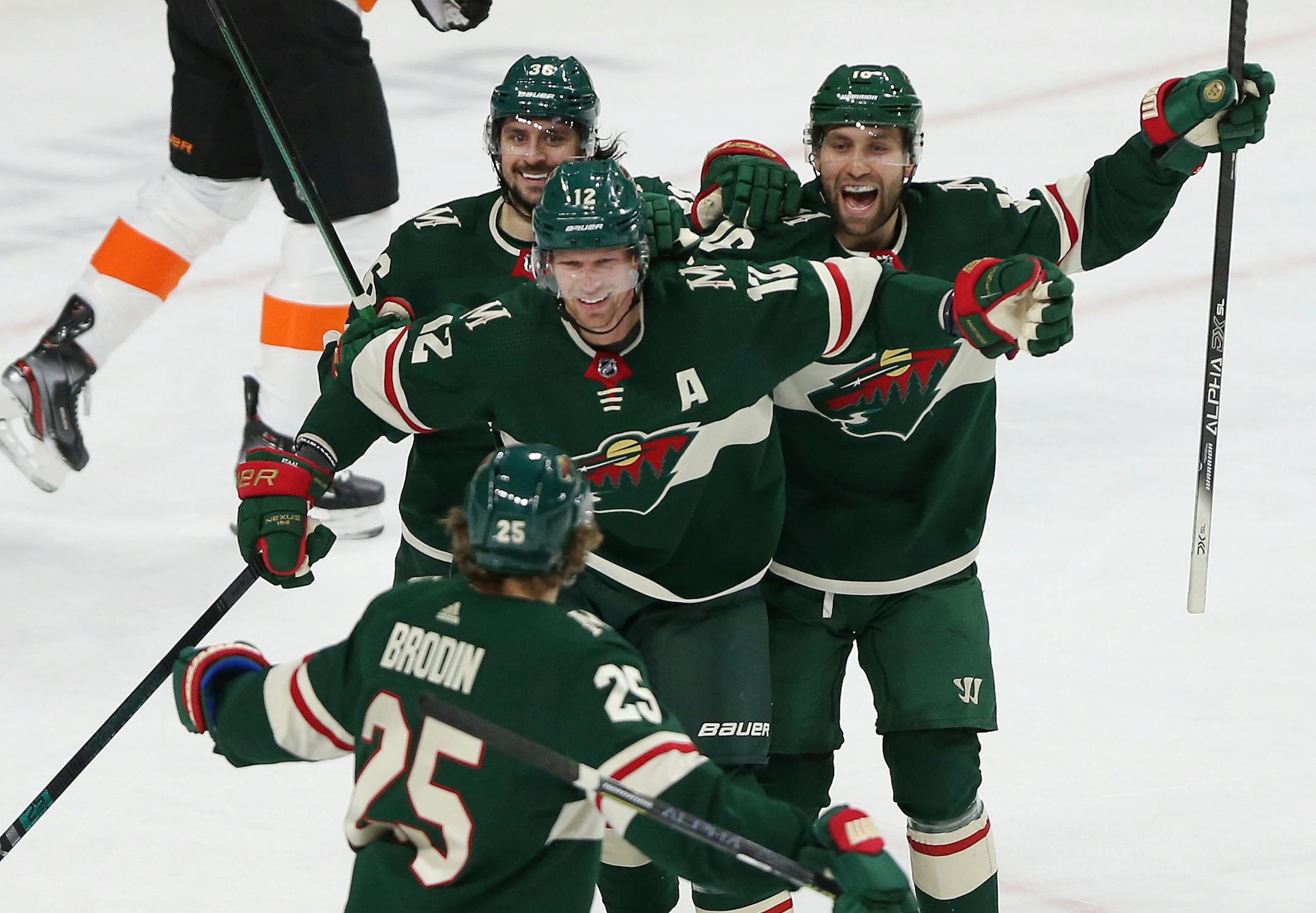 Minnesota Wild's Eric Staal looks to teammate Jonas Brodin in celebration after Staal scored a goal against the Philadelphia Flyers in the first period of an NHL hockey game Saturday Dec. 14, 2019, in St. Paul, Minn. (AP Photo/Stacy Bengs)