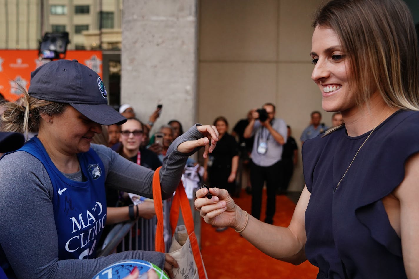 Chicago Sky guard Allie Quigley signed autographs for fans as she arrived at Target Center.