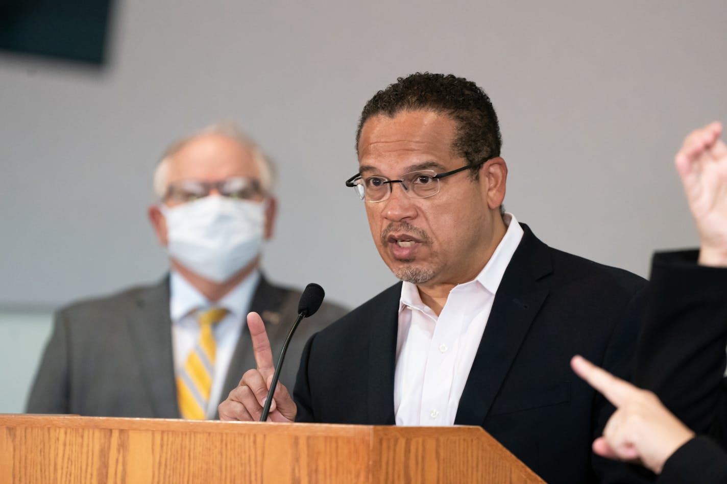 Gov. Tim Walz listened as Minnesota Attorney General Keith Ellison spoke at the press conference on Friday, May 29, about the unrest in the wake of the death of George Floyd while he was in custody of Minneapolis police.