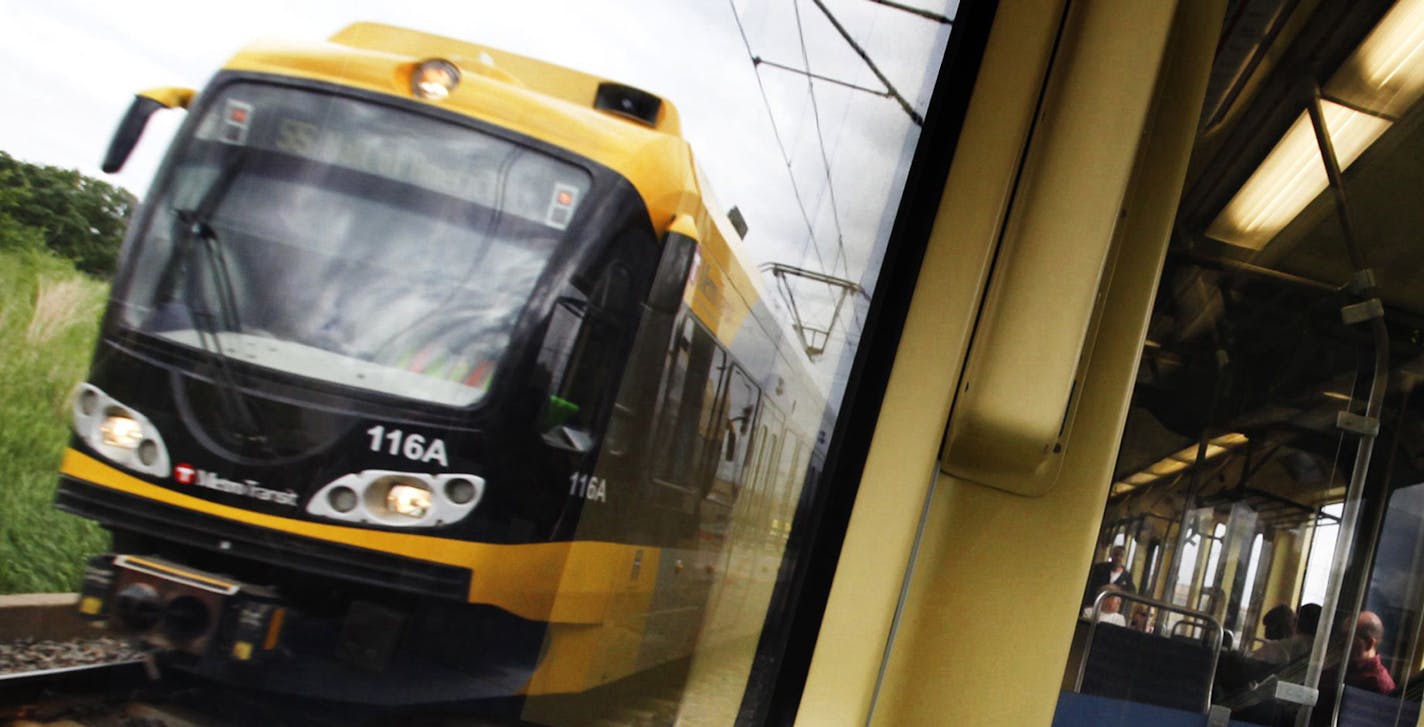 DAVID JOLES &#xef; djoles@startribune.com -June 2, 2011- Minneapolis, MN- In this photo:] Riders take the light-rail during morning rush hour. Once derided as a &#xec;train to nowhere," the Hiawatha light-rail line carries enough riders over 12 miles that it's cheaper to run than city buses. The daily cost per passenger mile of operating the Hiawatha between Bloomington and downtown Minneapolis is nearly half that of metro buses throughout the Twin Cities, according to the federal government. Th