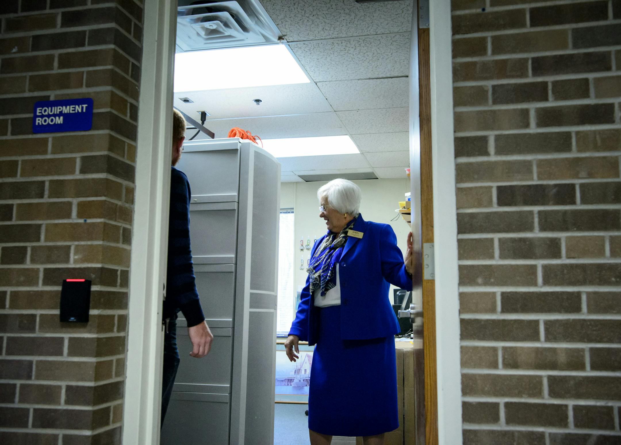 Mayor Kathi Hemken and director of human resources and administrative services in the New Hope City Hall former mayor's office which is now a computer server room. ] GLEN STUBBE * gstubbe@startribune.com Friday, November 20, 2015 New Hope City Hall is a classic 1960s split level with all the accompanying problems. The 1968 building is full of low ceilings and cramped, awkward spaces. The mayor gave up her office years ago to make room for computer servers. We photograph Mayor Kathi Hemken @ city