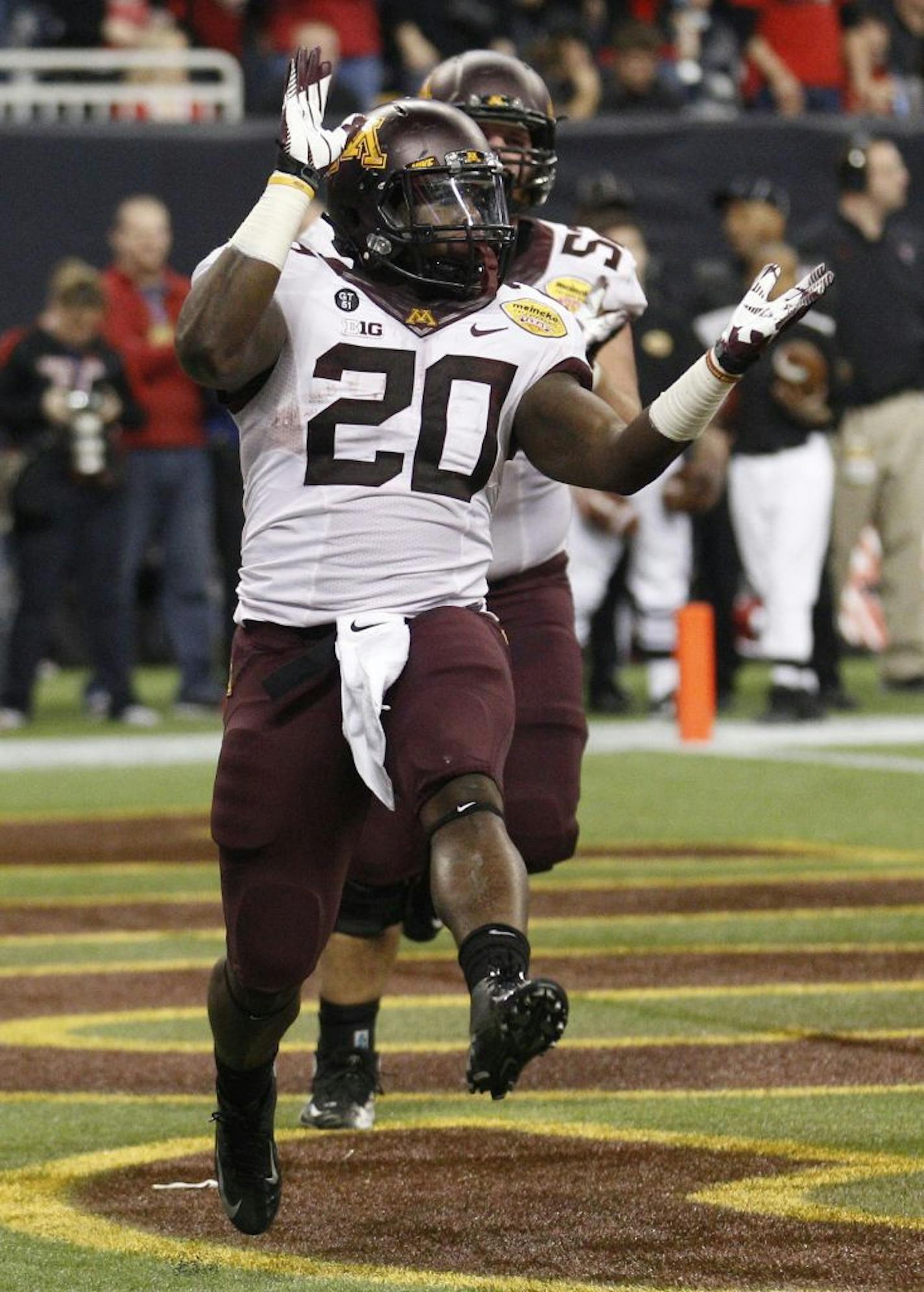 Minnesota's Donnell Kirkwood (20) celebrates a touchdown during the second quarter against Texas Tech in the Meineke Car Care Bowl of Texas on Friday, December 28, 2012, at Reliant Stadium in Houston, Texas.