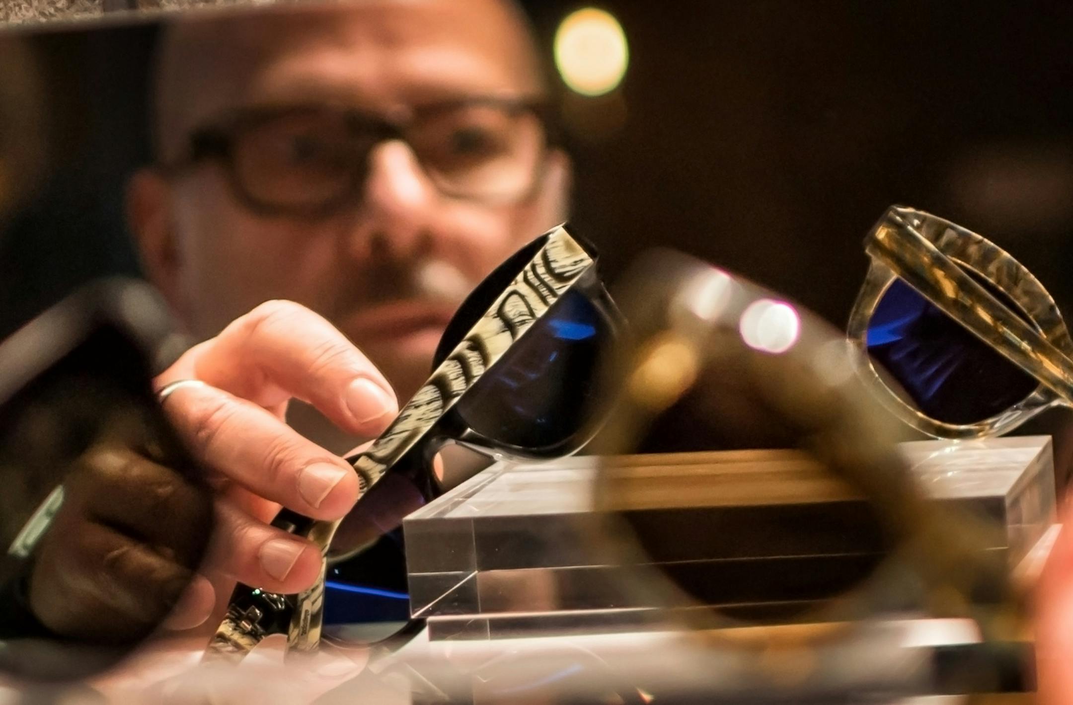 Product design director Jason Engelman arranged some of their new line of sunglasses in their store prototype in Minneapolis. ] GLEN STUBBE • glen.stubbe@startribune.com Wednesday, January 10, 2018 Eyebobs, the company founded in 2001 to create irreverent, high quality eyeglass readers, has a new CEO and expansion plans. The company's first retail store will open in MOA in May and later in 2018 in Orlando. It's also expanding beyond the 40+ market to prescription eyewear and sunglasses fo