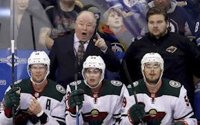 Minnesota Wild's head coach Bruce Boudreau reacts to a referee's call after a disallowed goal during the first period of an NHL hockey game against th