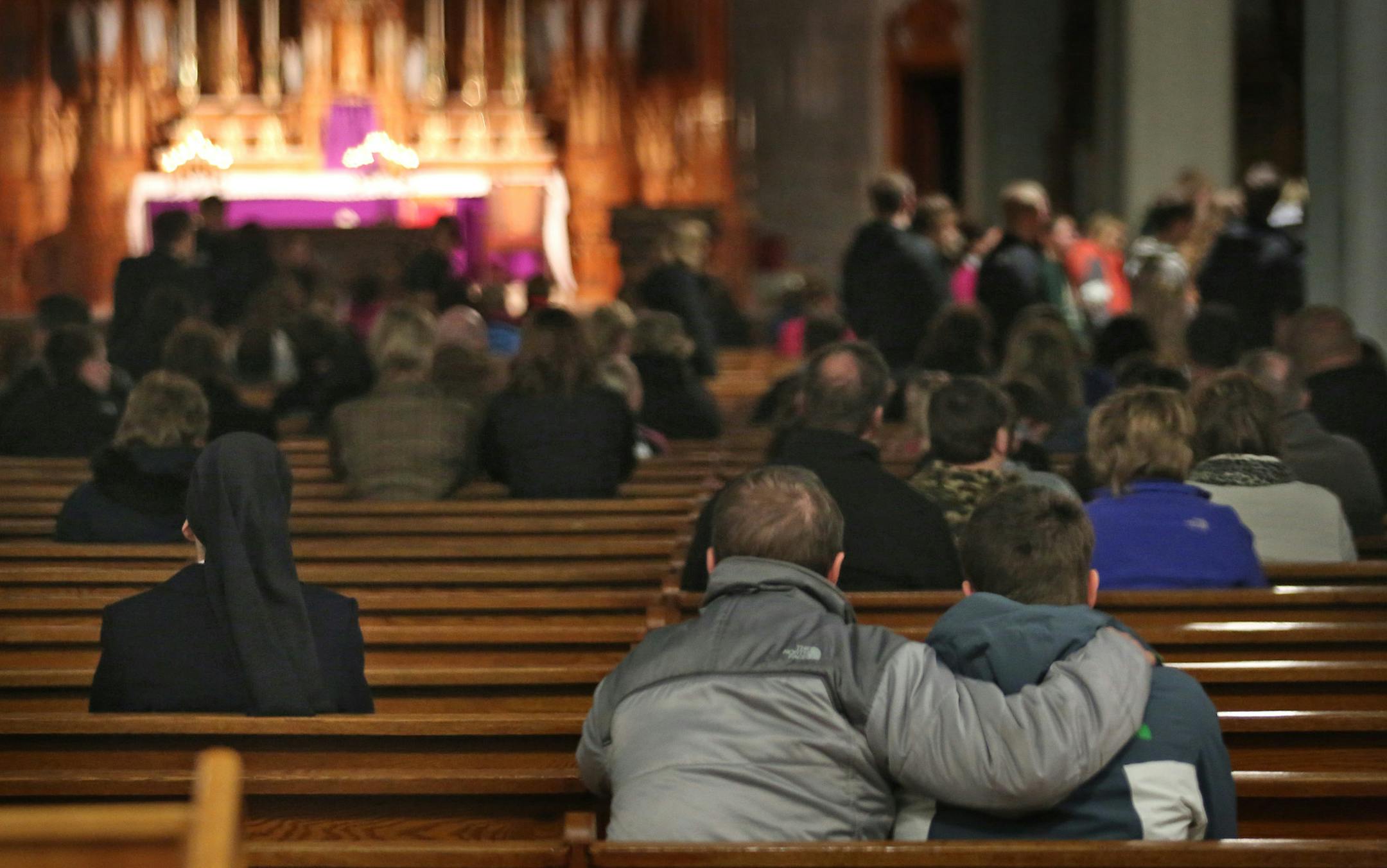 Parishioners comforted each other after the Saturday prayer service in Sleepy Eye, Minn., for the four young men who died in an ice-related car accident on Friday.