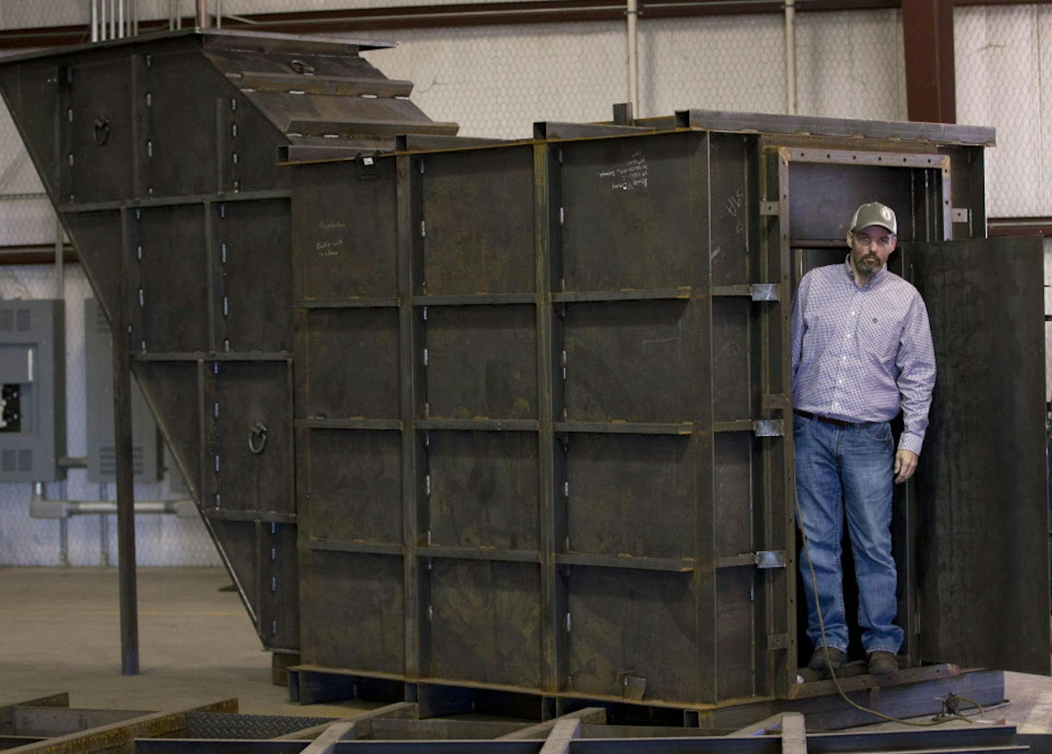 Gary Lynch with a bomb shelter under construction at Rising S Co. (Joyce Marshall/Fort Worth Star-Telegram/TNS) ORG XMIT: 1196819