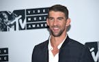 Michael Phelps poses in the press room at the MTV Video Music Awards at Madison Square Garden on Sunday, Aug. 28, 2016, in New York. (Photo by Evan Ag