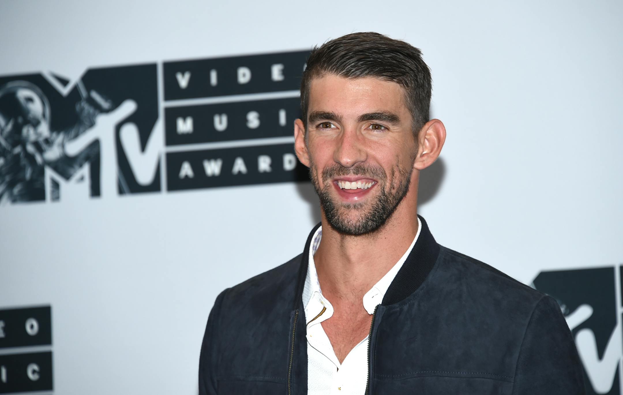 Michael Phelps poses in the press room at the MTV Video Music Awards at Madison Square Garden on Sunday, Aug. 28, 2016, in New York. (Photo by Evan Agostini/Invision/AP)