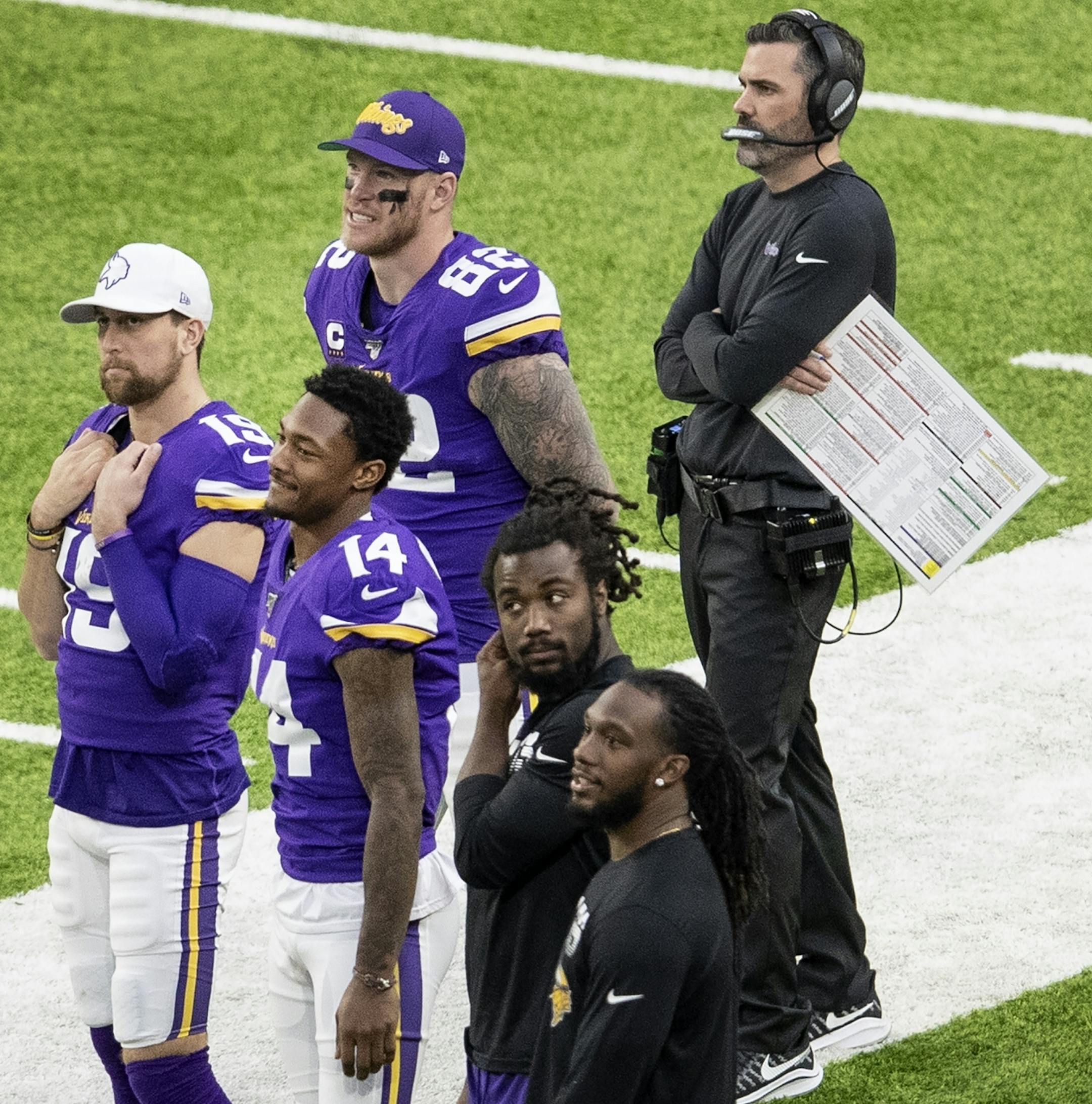 Minnesota Vikings players Kyle Rudolph, Adam Thielen, Stefon Diggs, Dalvin Cook and Alexander Mattison on the sidelines in the fourth quarter.