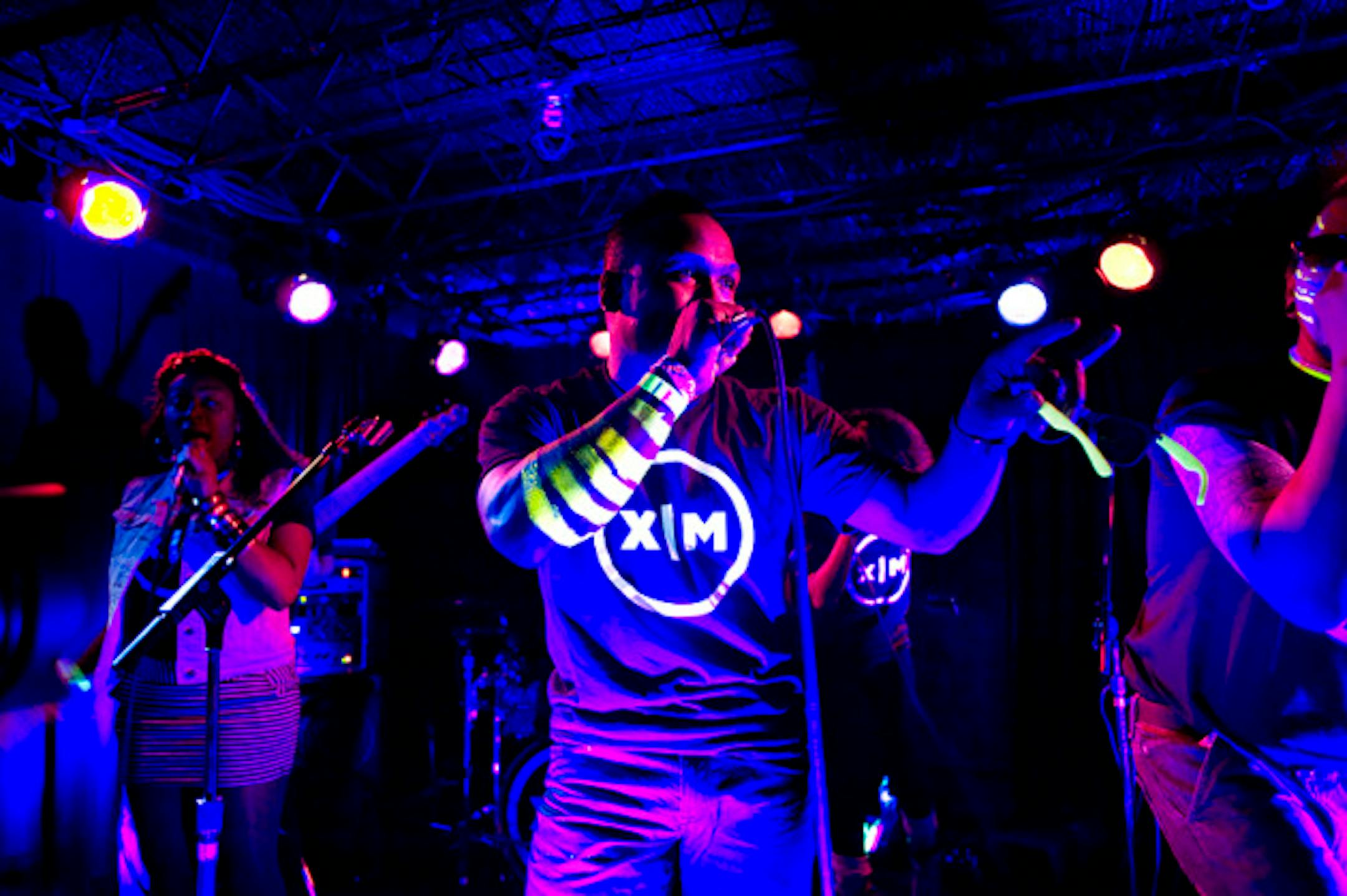 Xavier Marquis and his neon hip-hop band in the Entry.