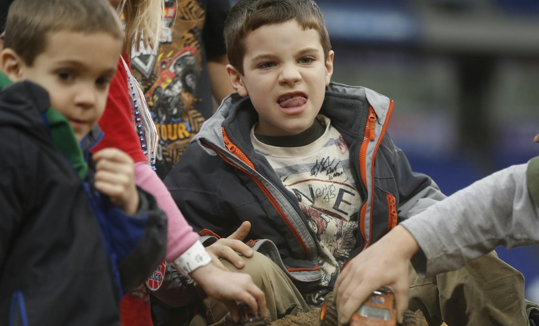 At the Metrodome where the last monster truck rally is being held before the building is demolished, Ben Stramstad,7, of New Richmond was excited to race his miniature monster truck on a sand pile in the pit.]richard tsong-taatarii/rtsong-taatarii@startribune.com