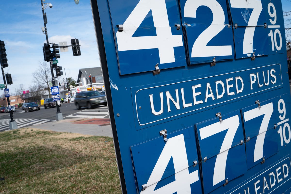 Gas prices are posted at a corner gas station in Washington D.C. 