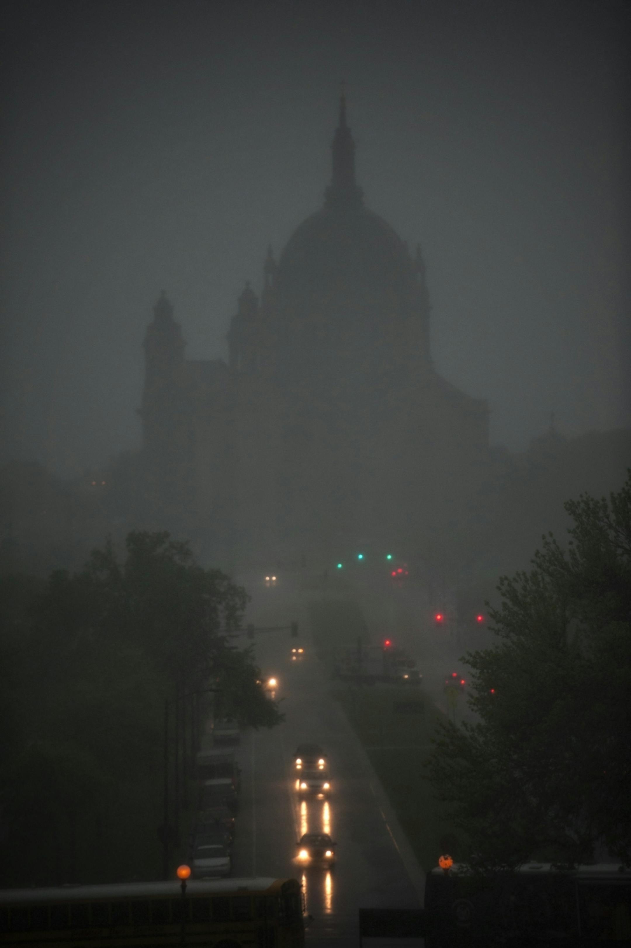 Heavy rain showers moved through St. Paul Thursday morning blocking out the Cathedral of St. Paul from the Capitol. Thursday, May 3, 2012.