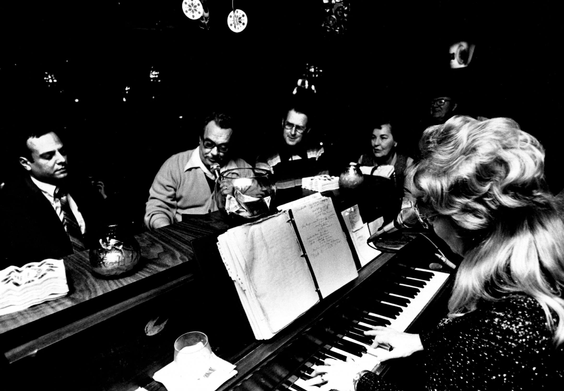 January 30, 1982 A customer took a microphone and sang while Lou Snider played at the piano bar in Nye's Polonaise Room. Kraut and slabs of tender spareribs. Bartender John Battner says that some night of the surveys the seven stools, flips on the electronic drums and plays Blessed Are the Believers. When that's over, she smiles at the bearded man, says "You gonna sing or just sit around?" then breaks into Could I Have This Dance? and then Stardust. January 11, 1982 John Croft, Minneapolis Star