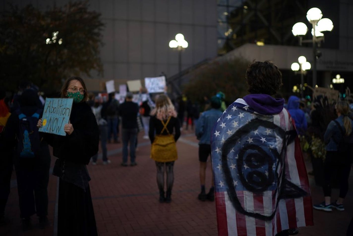 demonstrators listened to speakers on the plaza of Hennepin County Government Center.