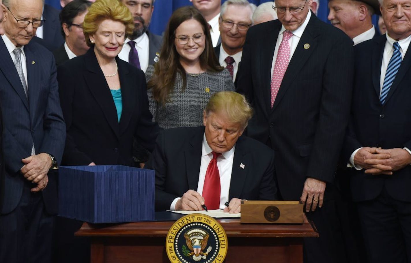 President Donald Trump signed the farm bill Thursday in Washington. The signing came after Congress dropped a proposal to toughen work requirements. But new proposed regulations would make it harder for states to grant exemptions, like parts of rural Minnesota have received.