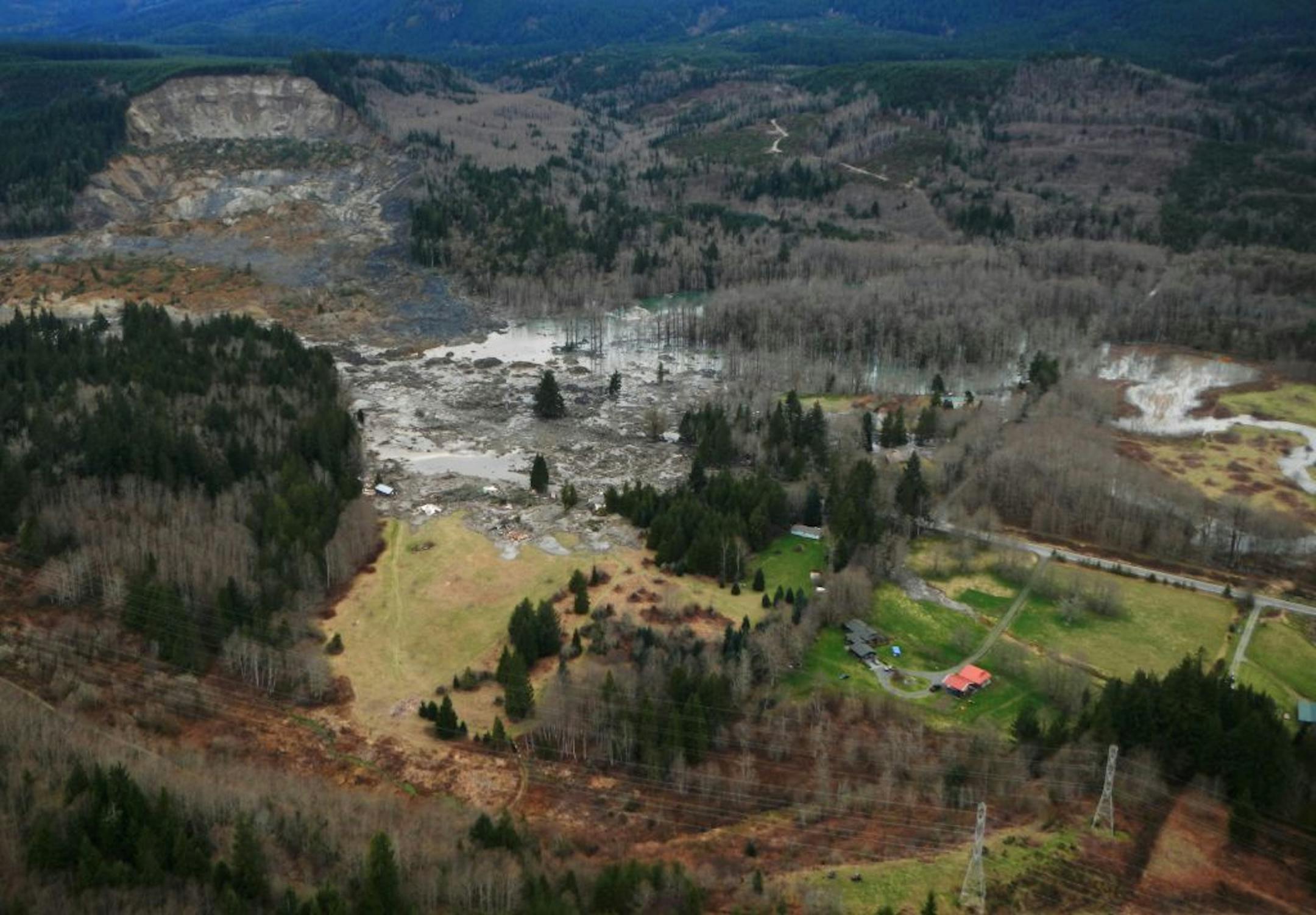 This March 23, 2014 photo, made available by the Washington State Dept of Transportation shows a view of the damage from Saturday's mudslide near Oso, Wash.