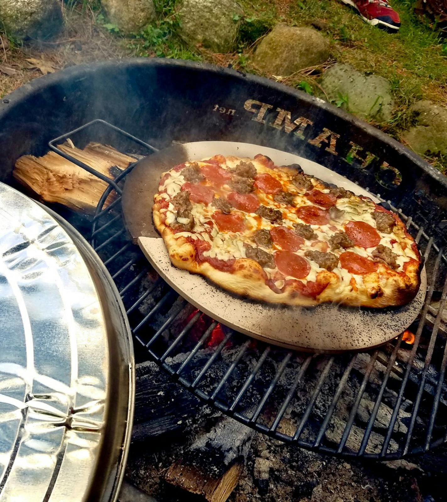 "Famous Dave" Anderson has a cabin in the north woods of Wisconsin, where he grows vegetables and grills as much as he wants. Here is a pizza grilling on a recent trip. Provided photo