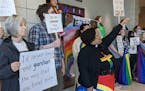 Students and community members chant at a Becker school board meeting March 14 to protest a presentation by a group considered by many to be anti-LGBT