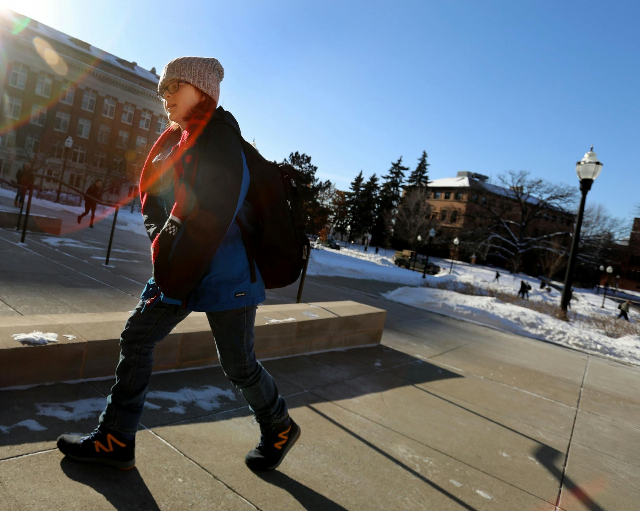 Elliott Tanner, 11, a junior at the University of Minnesota, walks from calculus four class to Earth and Environment class.