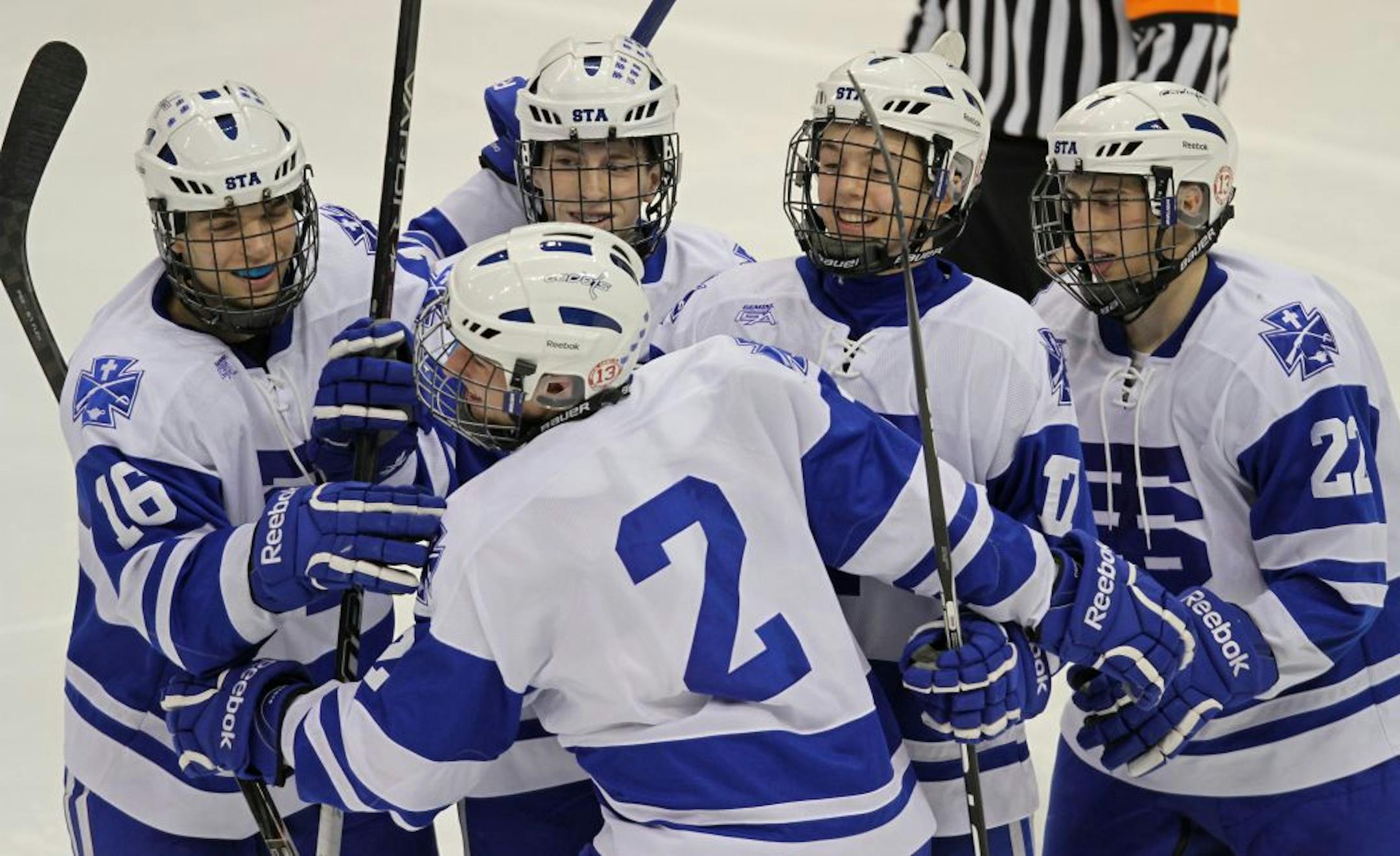 Boys State Hockey Tournament, Class A quarterfinals, St. Thomas Academy vs. Little Falls, 3/7/12. (center) St. Thomas Academy's Jack Dougherty celebrated his 3rd period goal with teammates.