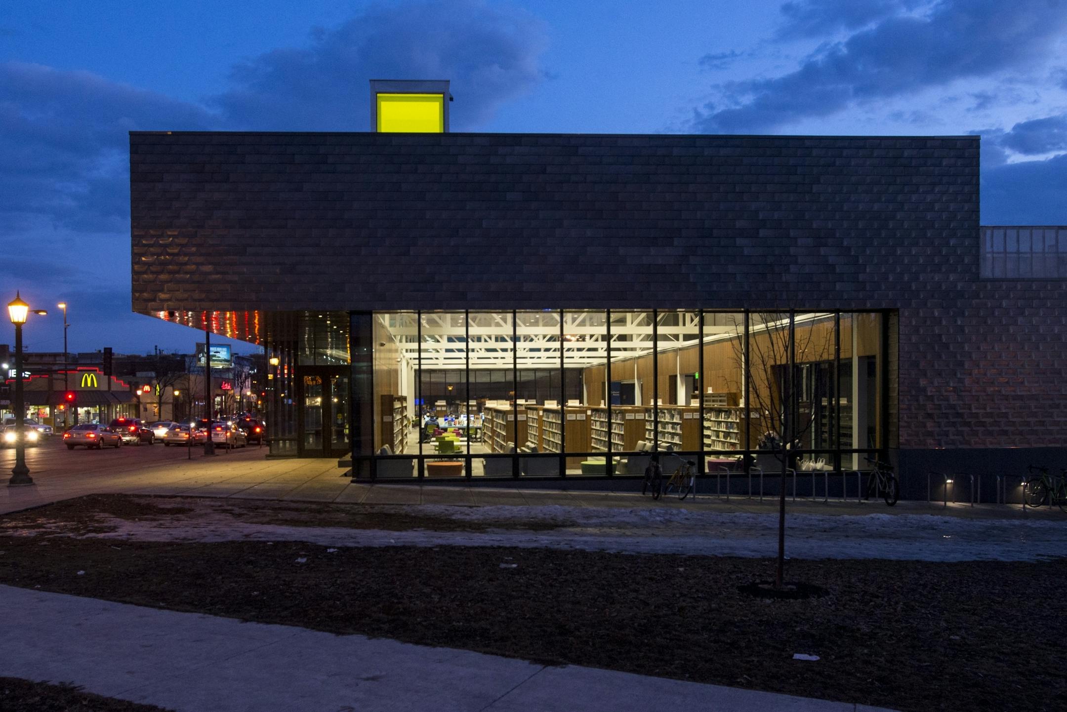 The inside of Walker Library is illuminated as the sun sets.