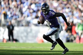 Baltimore Ravens quarterback Lamar Jackson (8) looks to pass the ball during the second half.