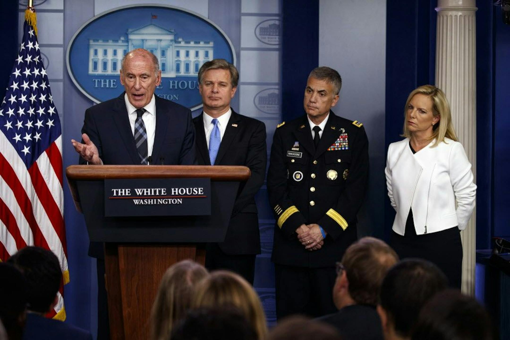 Director of National Intelligence Dan Coats speaks during the daily press briefing at the White House, Thursday, Aug. 2, 2018, in Washington, as FBI Director Christopher Wray, National Security Agency Director Gen. Paul Nakasone, and Secretary of Homeland Security Kirstjen Nielsen listen. The White House says President Donald Trump has directed a "vast, government-wide effort" to protect American elections after Russian attempts to interfere in 2016.