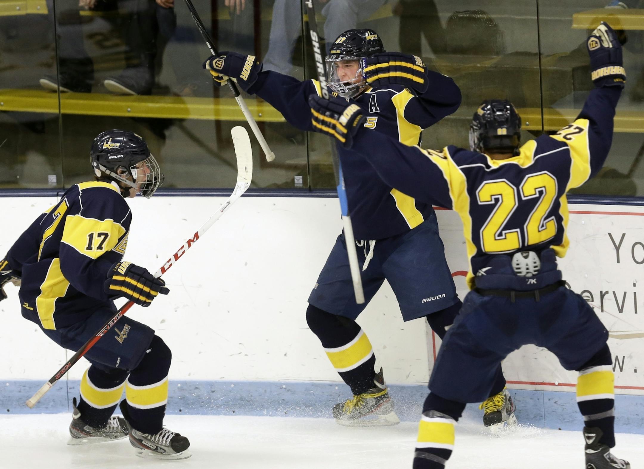 The Lakers celebrate their 1-0 lead in the second period .