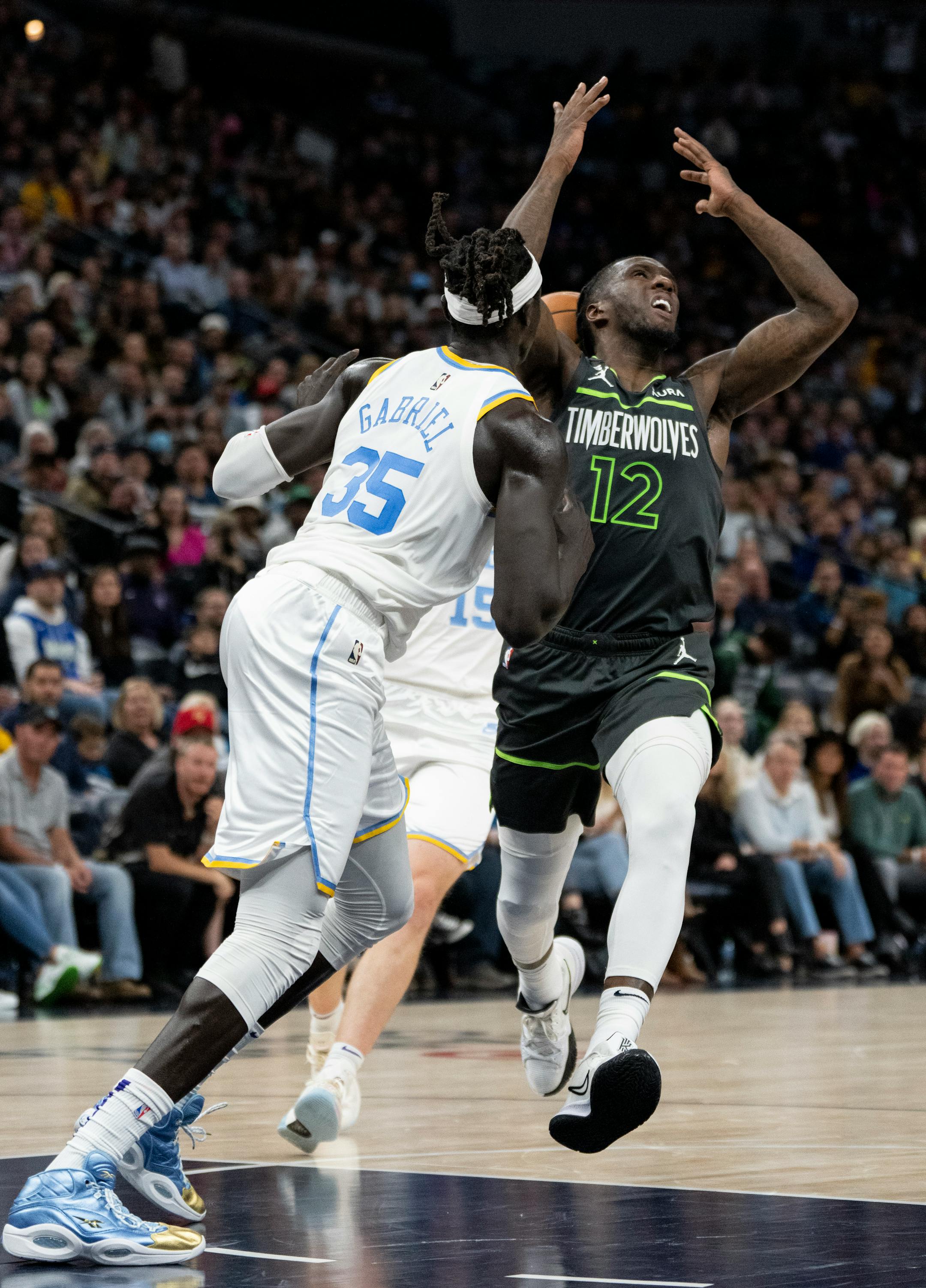 Minnesota Timberwolves forward Taurean Prince (12) loses the ball while running down court in the fourth quarter.