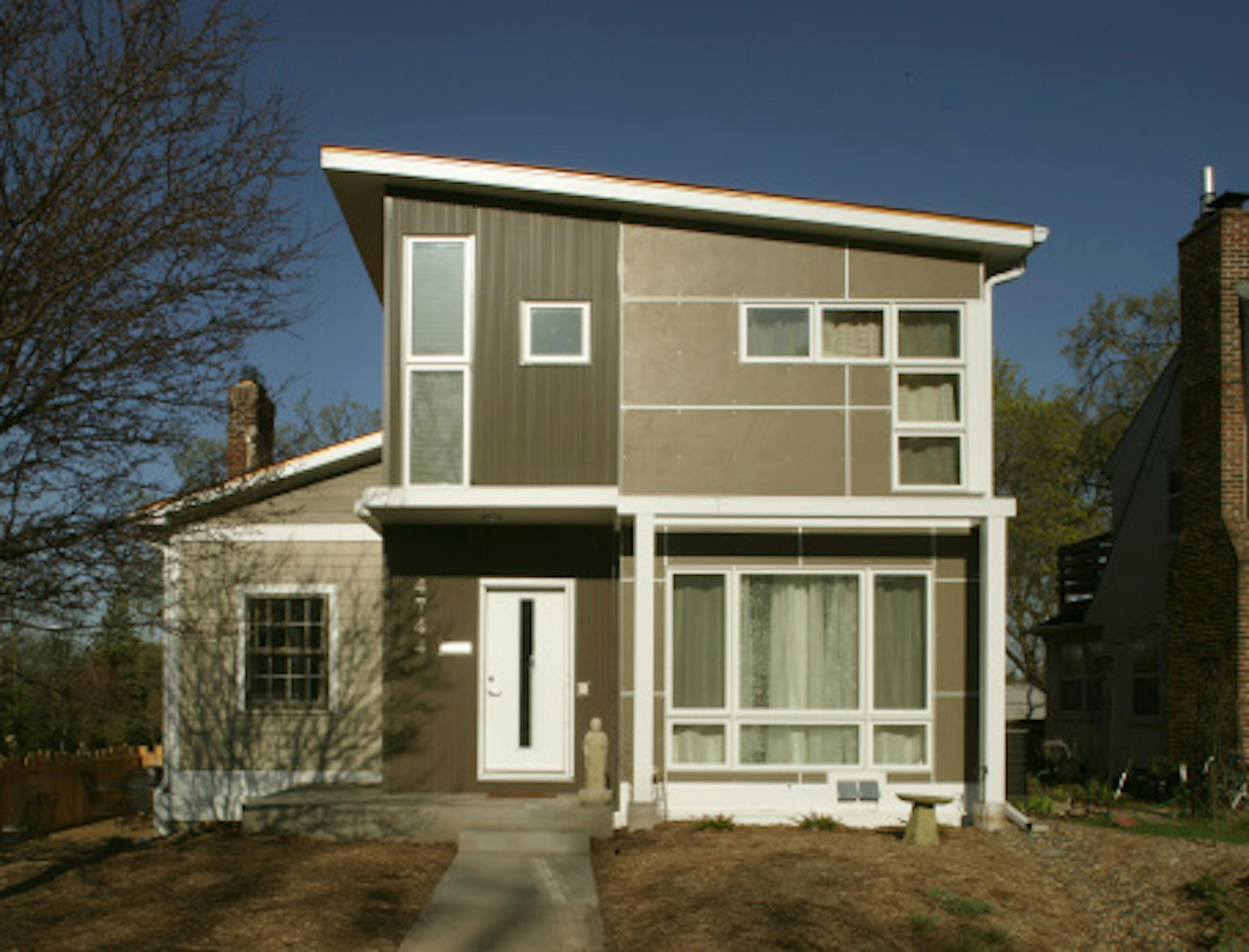 joel koyama\u2022jkoyama@startribune.com renogreen0510  00007695a]   Exterior of Rob Herman's South Minneapolis house. 'Rob Herman remodeled his Minneapolis house to be green. He used recycled materials -- including sunflower seed flooring and refurbished wood -- and installed geo-thermal, water run-off systems, etc.