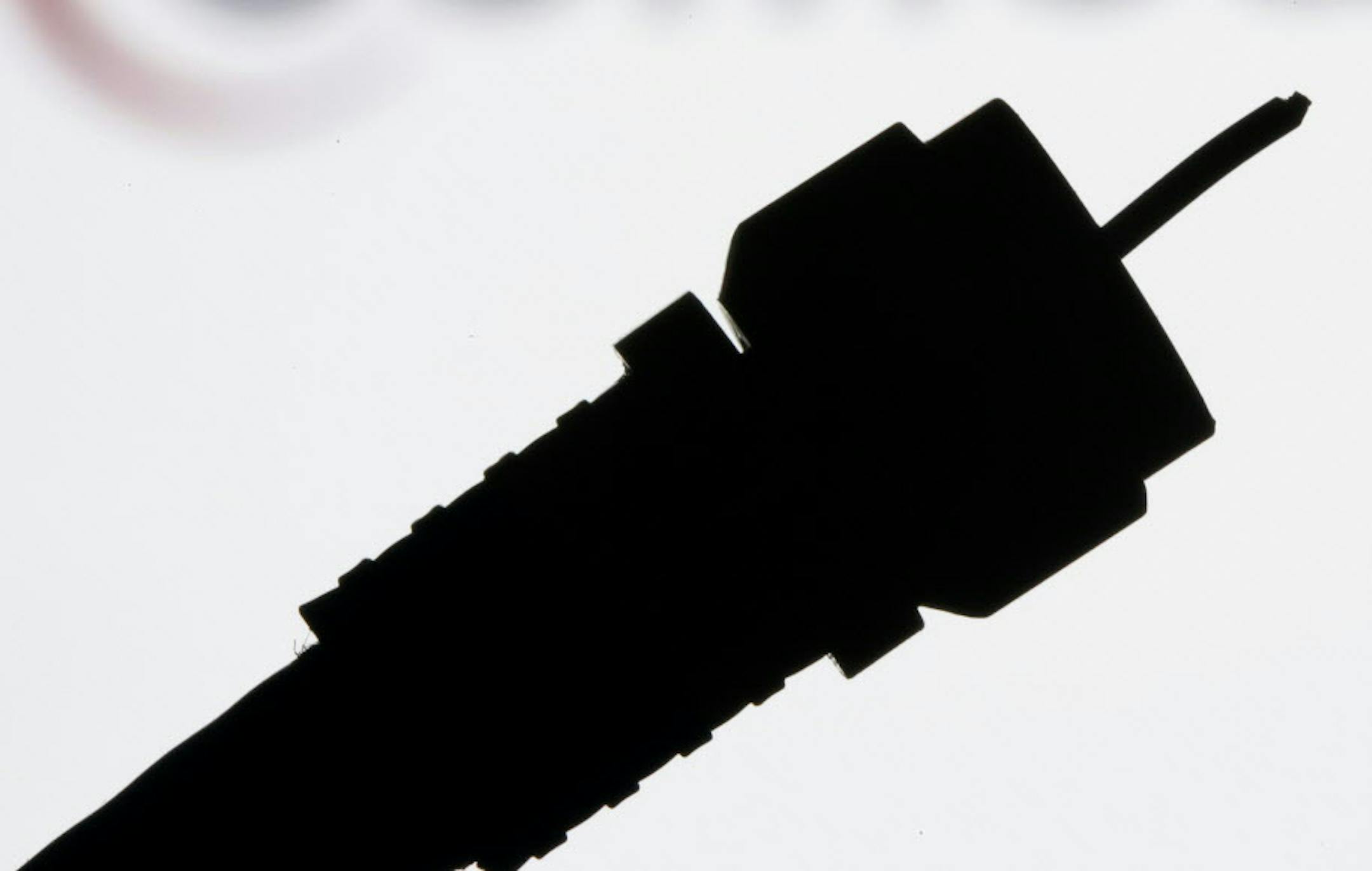 FILE - This July 30, 2008 file photo shows a silhouetted coaxial cable in Philadelphia. Cord cutters rejoiced last week after HBO and CBS announced plans to sell stand-alone streaming services, a move that cable and satellite television providers have resisted for years. But cutting the cord wonít mean cutting out your cable provider, and some would-be customers may balk when they see just how much paying a la carte actually costs. (AP Photo/Matt Rourke, File)