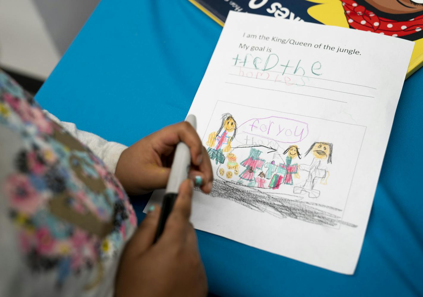 Moriah Brooks, 7, filled out a paper with her goals of feeding the homeless people by her school after Habso Mohamud, 24, a St. Cloud author who wrote a children's book to inspire kids to make a difference in the world, asked the children to write their goals at a reading at the Children's Museum in St. Paul, Minn., on Monday, January 21, 2019. ] RENEE JONES SCHNEIDER &#xa5; renee.jones@startribune.com