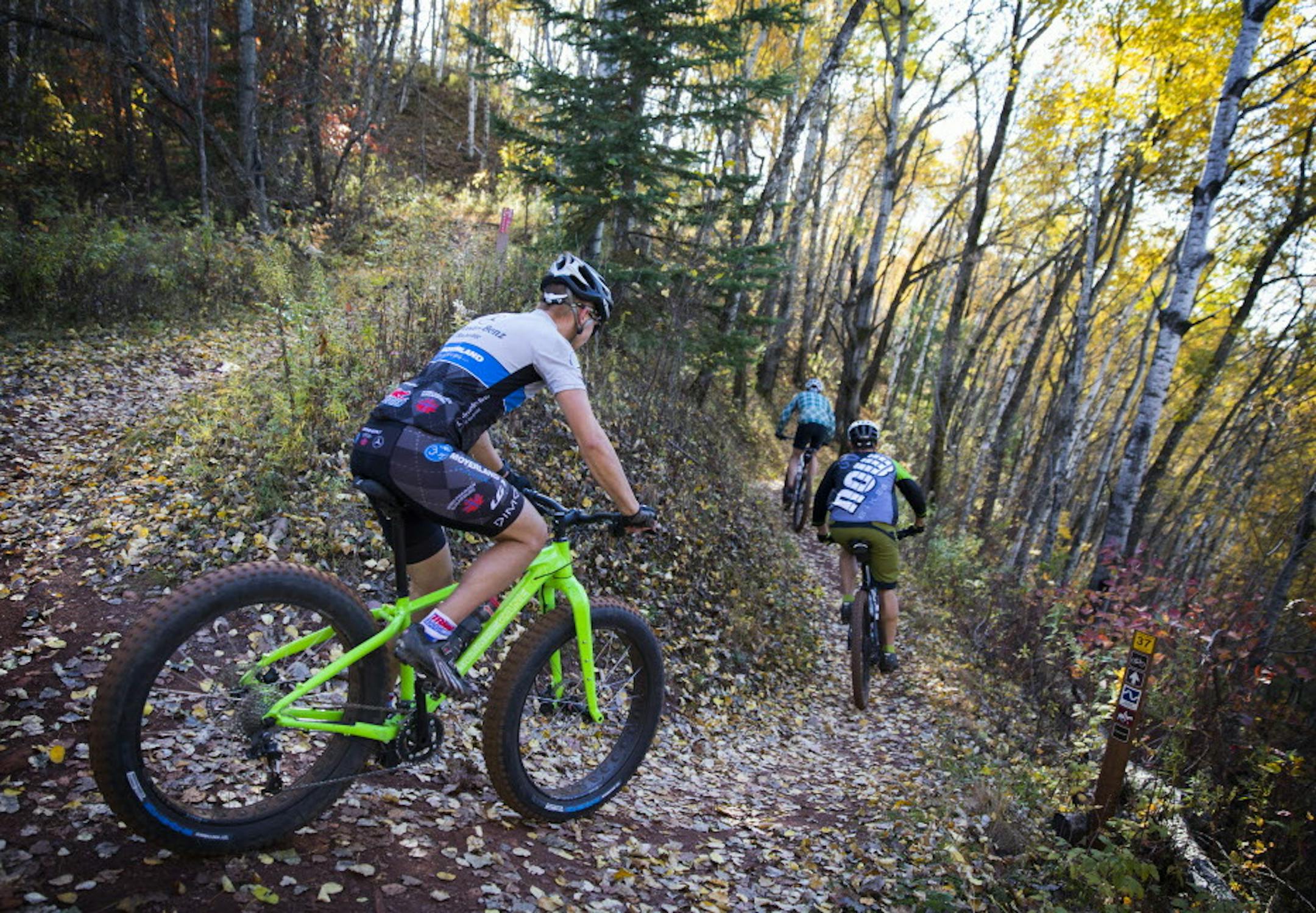 Mountain bikers make their way down a trail at Cuyuna Country State Recreation Area. ] LEILA NAVIDI &#xef; leila.navidi@startribune.com BACKGROUND INFORMATION: People ride the mountain bike trails at Cuyuna Country State Recreation Area near the communities of Crosby and Ironton on Friday, October 13, 2017. A popular mountain bike trail carved five years ago into a derelict ore mine in northern Minnesota drew tens of thousands of tourists this summer, pumping up the local economy in Crosby-Iront