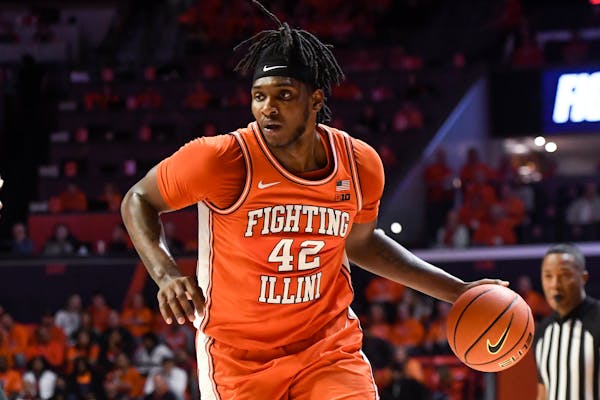 Illinois' Dain Dainja (42) dribbles the ball during the first half of the team's NCAA college basketball game against Michigan State, Friday, Jan. 13,