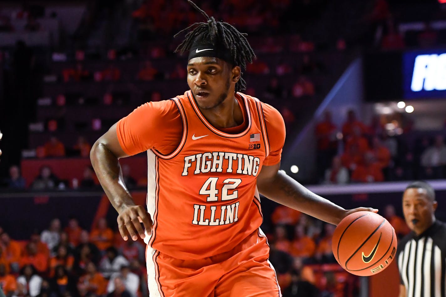 Illinois' Dain Dainja (42) dribbles the ball during the first half of the team's NCAA college basketball game against Michigan State, Friday, Jan. 13, 2023, in Champaign, Ill. (AP Photo/Michael Allio)