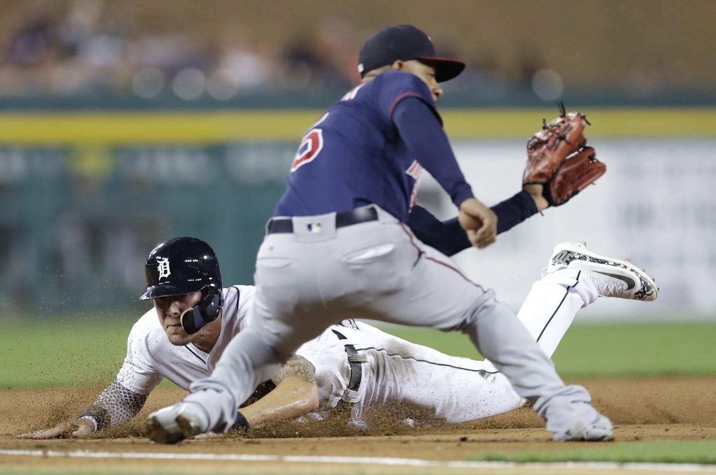 Longtime Twins infielder Eduardo Escobar, here awaiting a throw as Detroit's JaCoby Jones arrived at third base Friday, has played well for the injured Miguel Sano, and his play has not gone unnoticed by former Twins manager Tom Kelly.