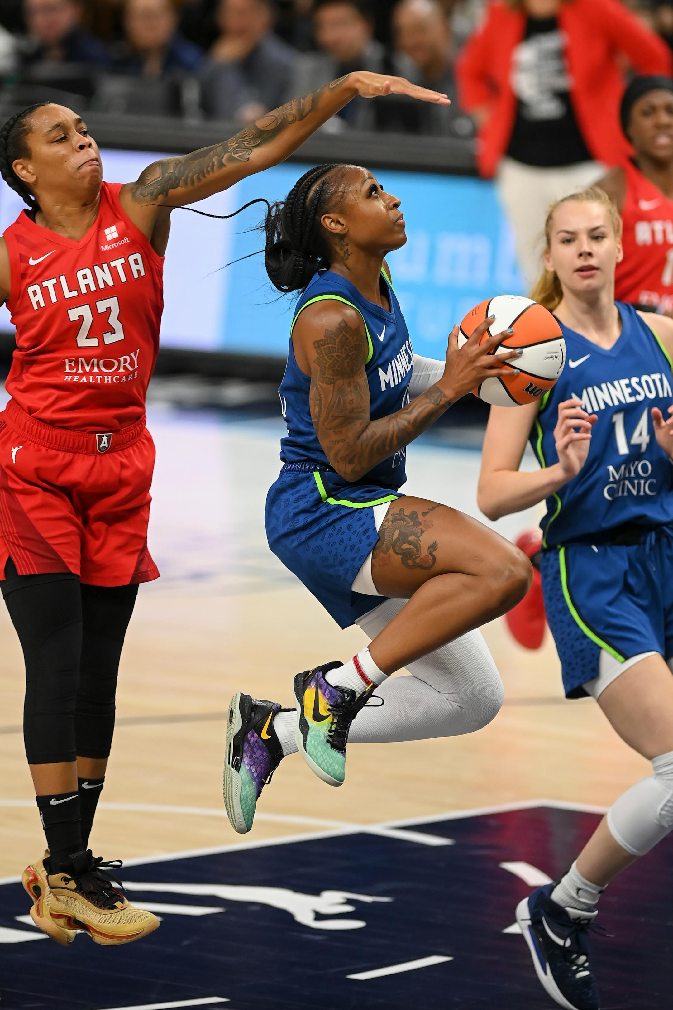 Minnesota Lynx guard Tiffany Mitchell drives toward the basket for a layup during the first quarter.