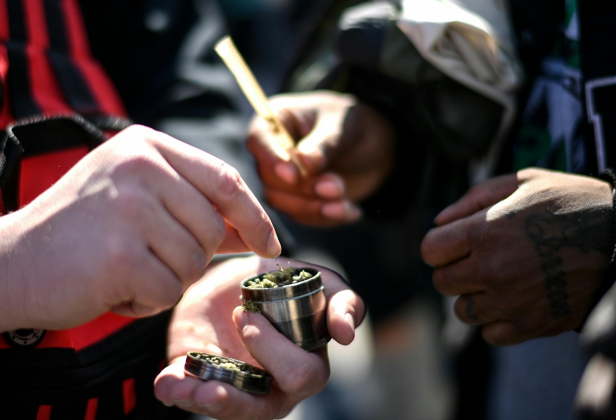 Attendees of Cannabis Awareness Day at the Minnesota Capitol worked on packing a joint Friday afternoon.