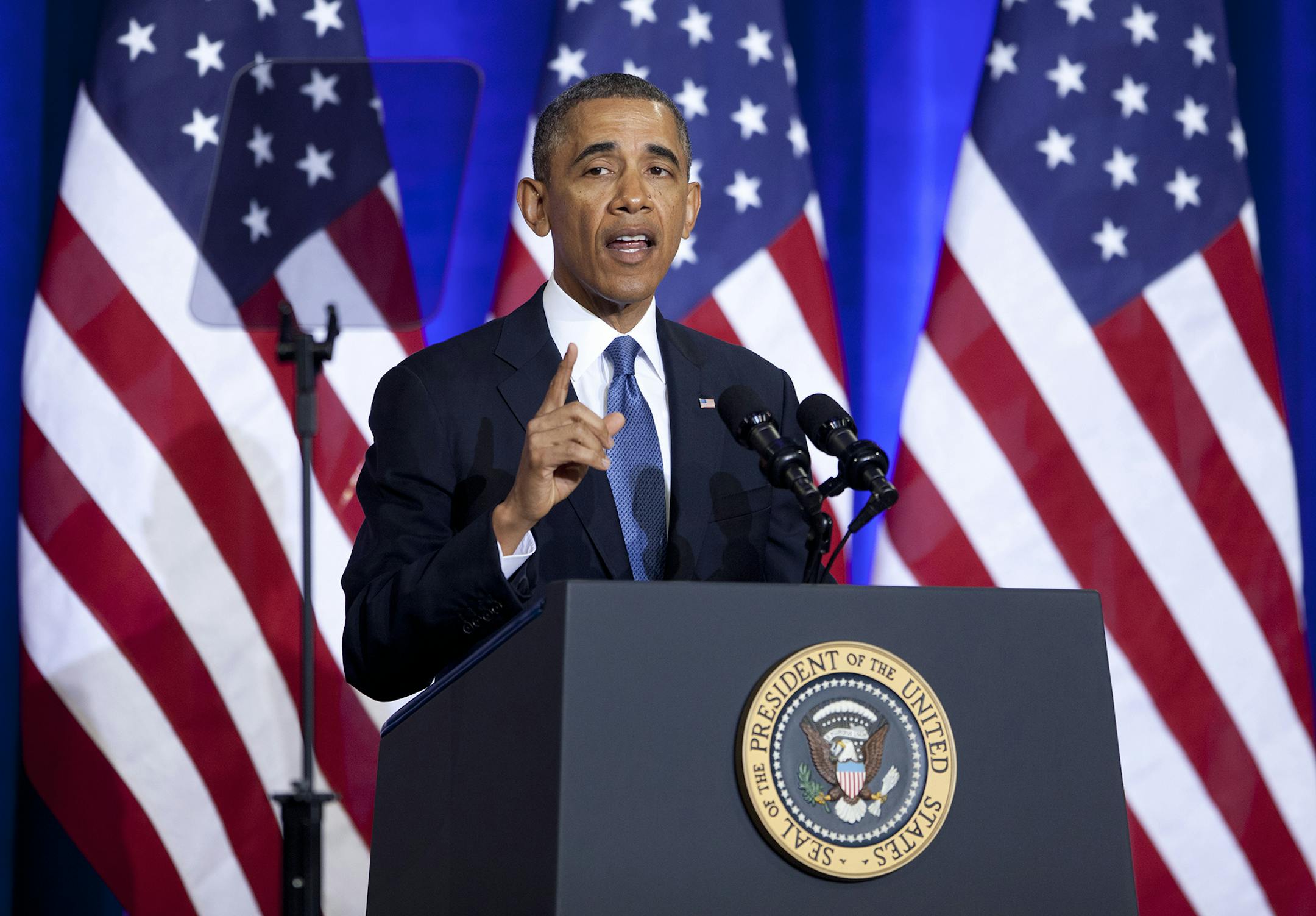 President Barack Obama gestures as he speaks about National Security Agency (NSA) surveillance, Friday, Jan. 17, 2014, at the Justice Department in Washington. The president called for ending the government's control of phone data from millions of Americans. (AP Photo/Carolyn Kaster) ORG XMIT: MIN2014012112383028