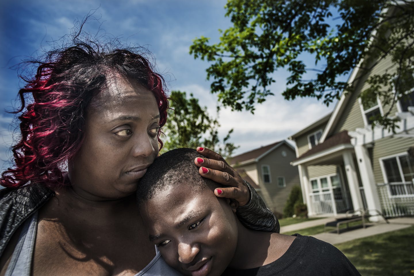 Melissa Coleman, Samuels' grandmother hugged grandson Kemarion Prowell,11, who was outside when 7-year-old Keyaris Samuels shot himself last nite. Samuels was home alone n his Plymouth home when a loaded handgun was discovered in a box with a toy and he accidentally shot himself with it, police said Thursday.
]Richard Tsong-Taatarii&#x2022;rtsong-taatarii@startribune.com