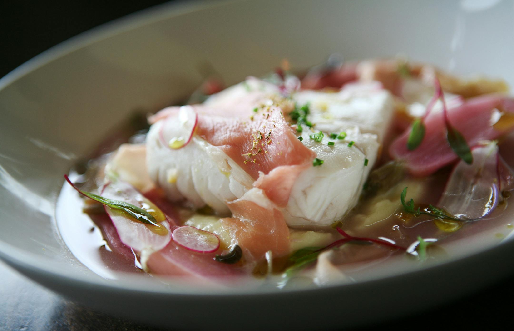 Poached halibut with ros&#x221a;&#xa9;, potato puree, breakfast radish and country ham at Corner Table in Minneapolis June 7, 2013. (Courtney Perry/Special to the Star Tribune)