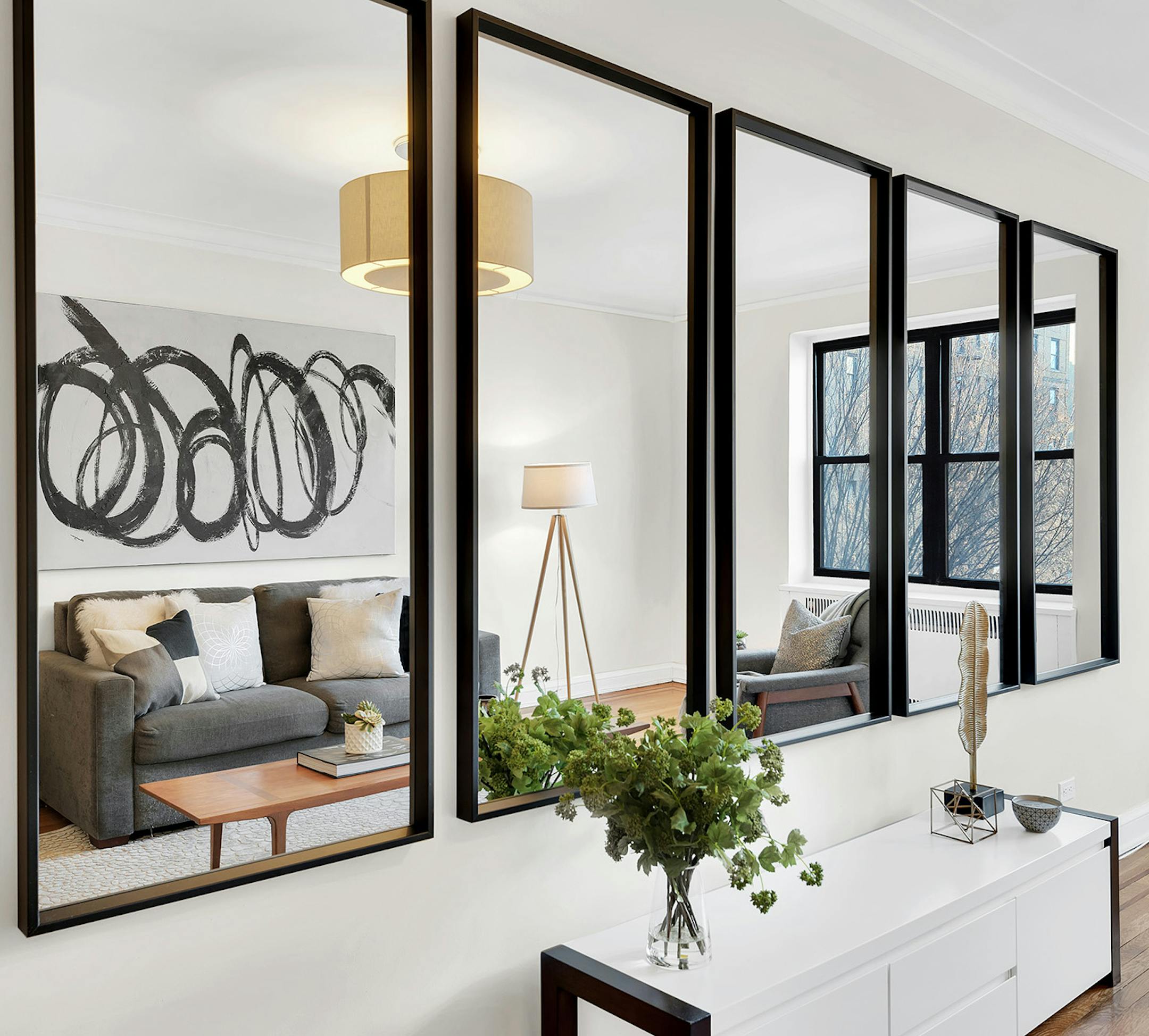 A series of mirrors adds interest to this living room. (Design Recipes/TNS)