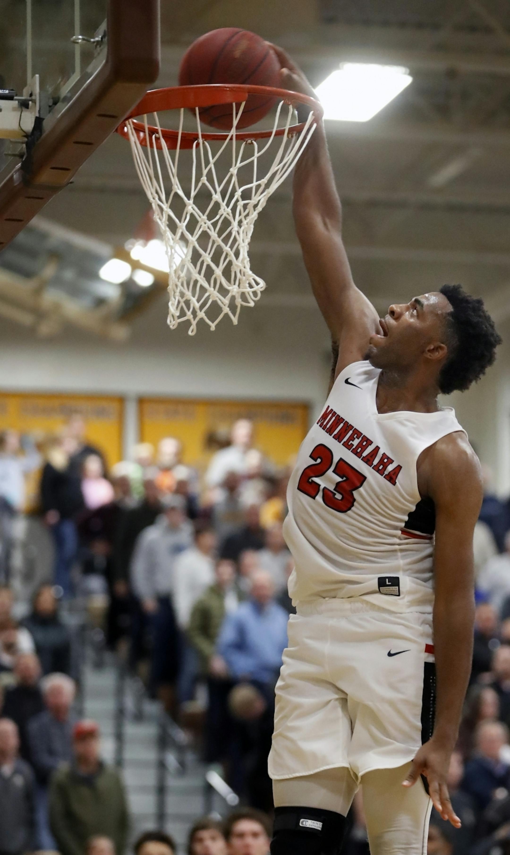 JaVonni Bickham(23) of Minnehaha makes a dunk that seals the game.