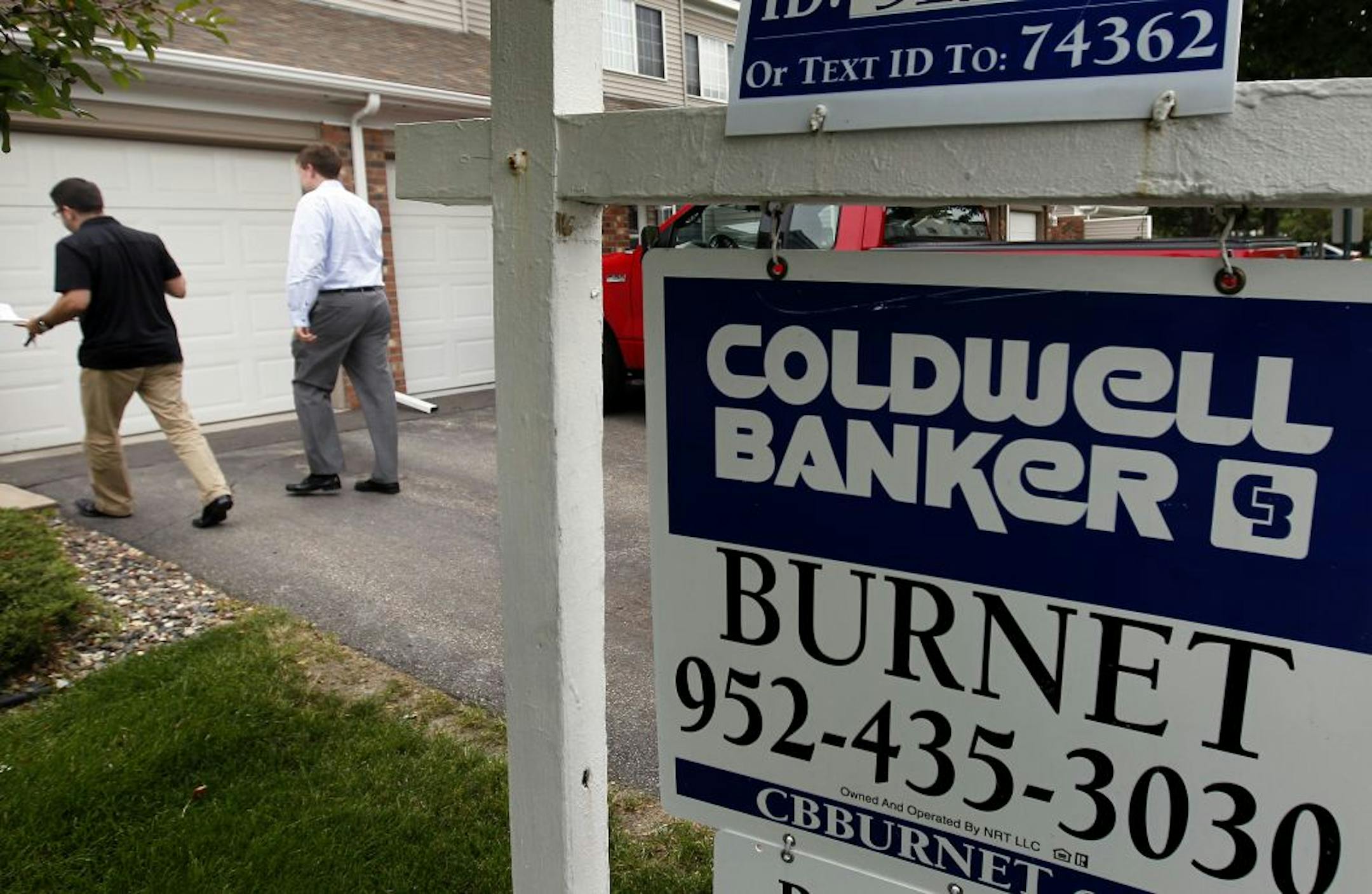 Realtor Steve Fiorella led Heath Stoll, 24, of Apple Valley to view a Townhome in Bloomington, Minn.