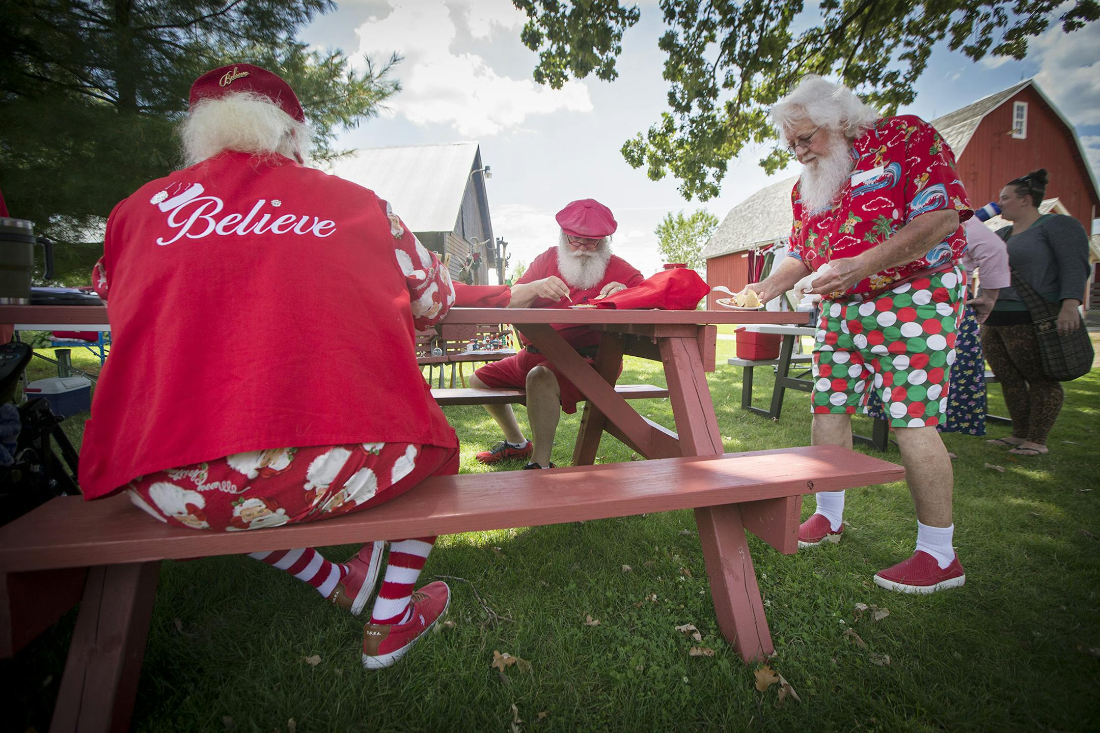 Christmas in July: Santa Mickey (Mickey Michlitsch) helped serve more than 80 members of the North Star Santas at a picnic in Maplewood last month.