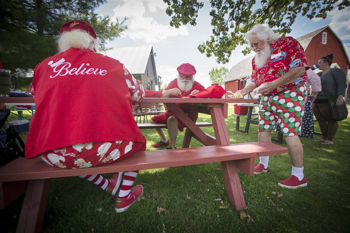 Christmas in July: Santa Mickey (Mickey Michlitsch) helped serve more than 80 members of the North Star Santas at a picnic in Maplewood last month.