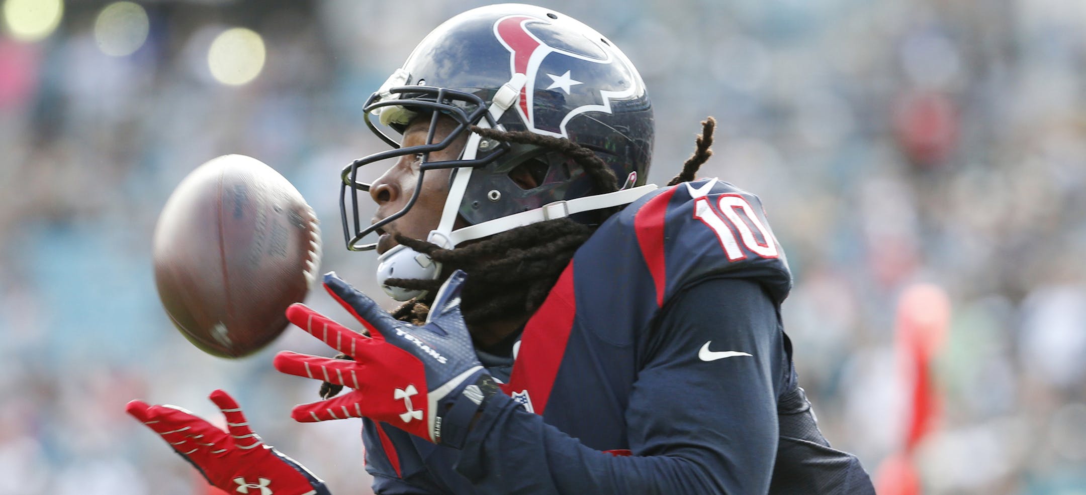 Houston Texans wide receiver DeAndre Hopkins (10) makes a catch for a 26-yard touchdown against the Jacksonville Jaguars during the second half of an NFL football game in Jacksonville, Fla., Sunday, Oct. 18, 2015. (AP Photo/Stephen B. Morton)